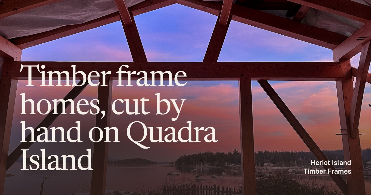 Heriot Island Timber Frames homepage preview: sunset over the water through a newly raised timber frame